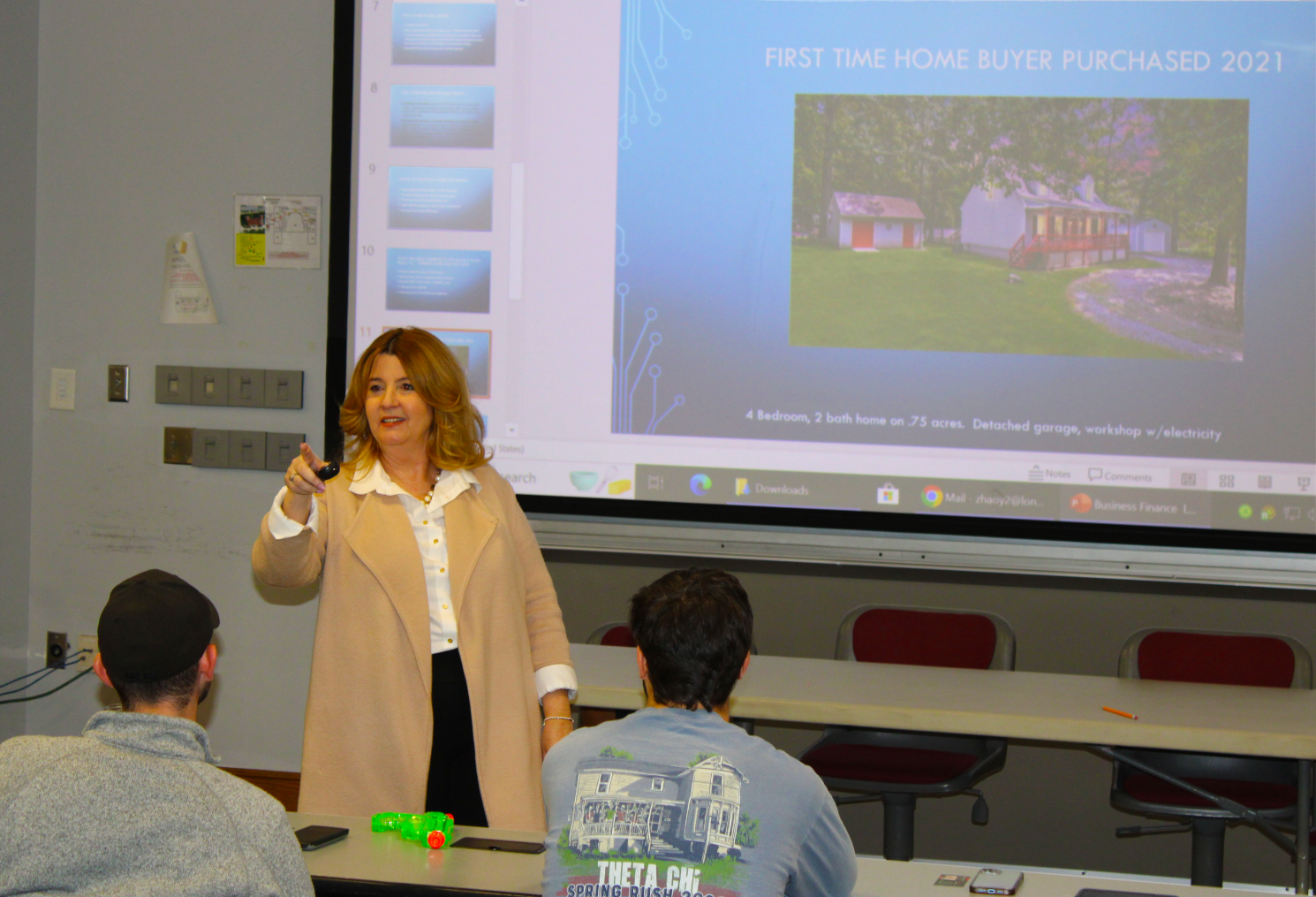 Patrice Carroll standing at the front of the classroom.