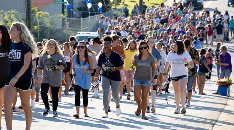 Longwood students marching up the hill at The G.A.M.E.