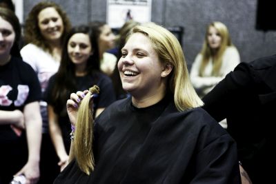 Co-chair Heather Hudson donates a lock of hair to Pantene's Beautiful Lengths, which provides real-hair wigs to cancer patients.