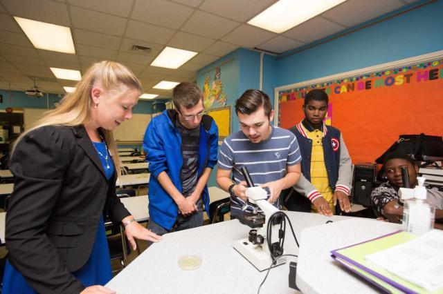 Dr. Amorette Barber, assistant professor of biology at Longwood, working with Prince Edward County High School students as they explore their local environment on a molecular level.