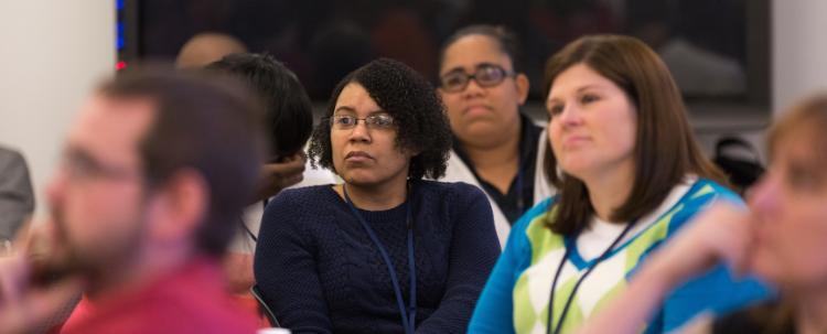 Teachers from around the state listen during a session of the Teacher Leadership Program