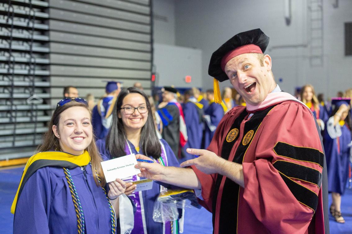 Dr. Christopher Swanson with some graduates